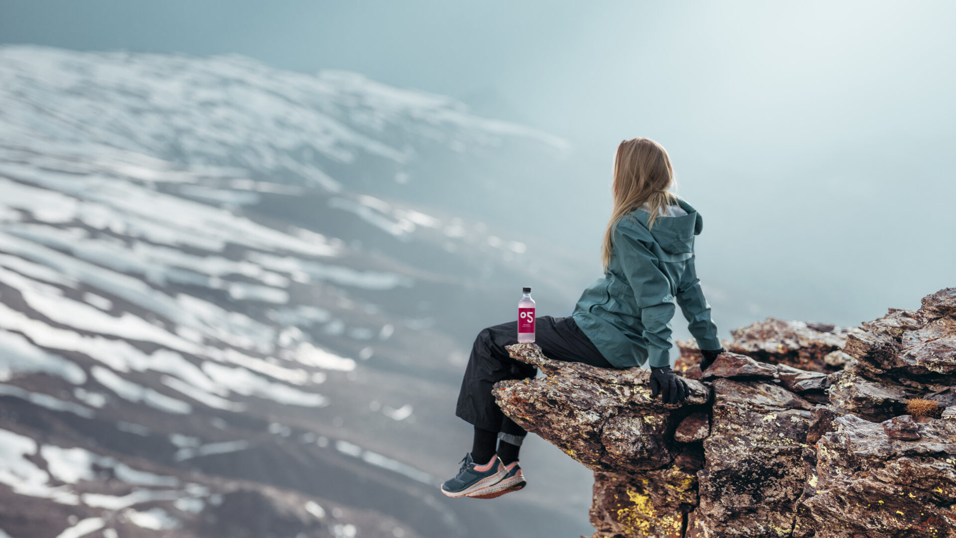 Woman on cliff with the bottle 08